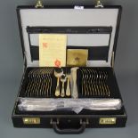 An unused Bestecke cased silver and gold plated cutlery set.