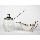 A hallmarked silver topped cut glass pickle jar with silver pickle fork and hallmarked silver