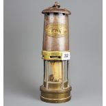 An E. Thomas and Williams Ltd original miner's lamp.