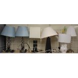 A group of seven contemporary table lamps.