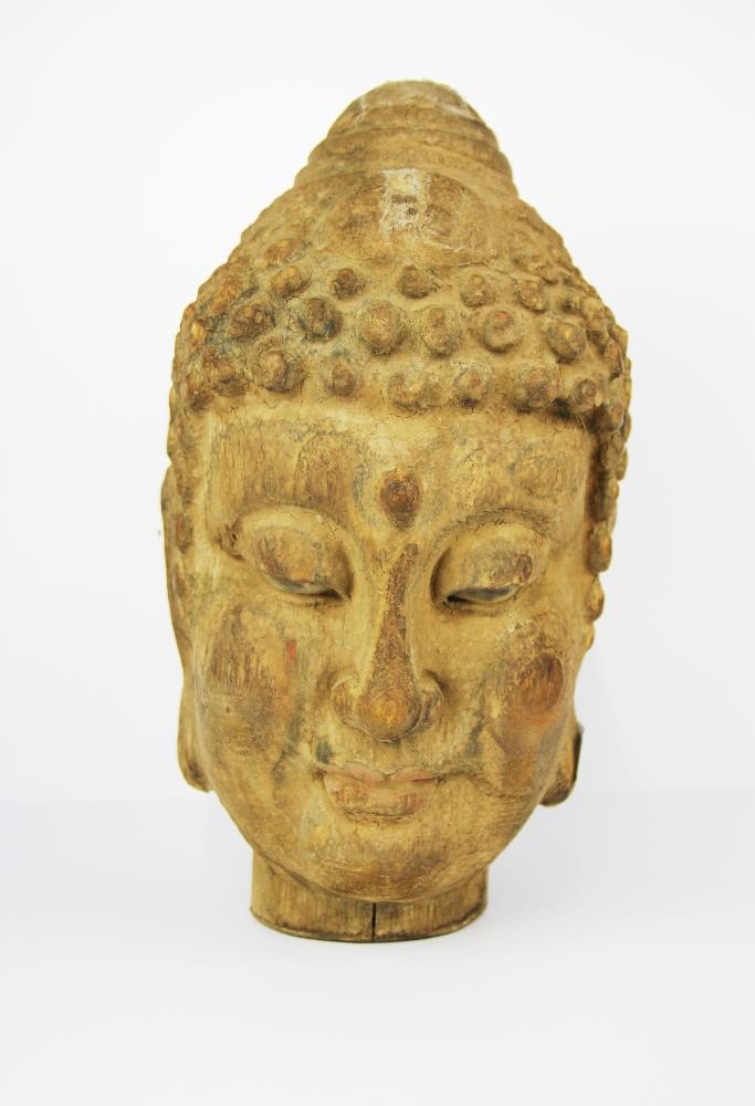 An unusual old Chinese carved double faced Buddha and Arhat head with remnants of gesso and