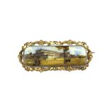 A Victorian gilt metal enamelled brooch depicting Crystal Palace L. approx. 7cm.