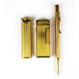 Two Dunhill gold plated lighters and a rolled gold propelling pencil.