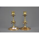 A pair of Arts and Crafts brass candlesticks inset with Pietra dura discs, H. 17cm.