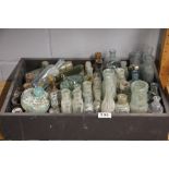 A collection of Victorian and earlier glass bottles.