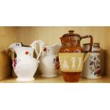 Five ceramic jugs including one Royal Doulton, tallest H. 24cm. Royal Doulton jug handle A/F.