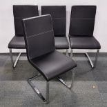 A set of four contemporary upholstered chrome chairs.