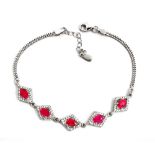 A 925 silver bracelet set with oval cut rubies and white stones, L. 18cm.