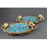 A pair of majolica fruit bowls decorated with birds and cherry blossom, L. 41cm.