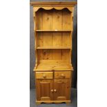 A small pine dresser and plate rack, W. 70cm. H. 187cm.