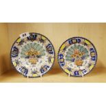 Two salt glazed pottery plates, one signed to back, largest plate Dia. 18cm. Larger plate repaired.