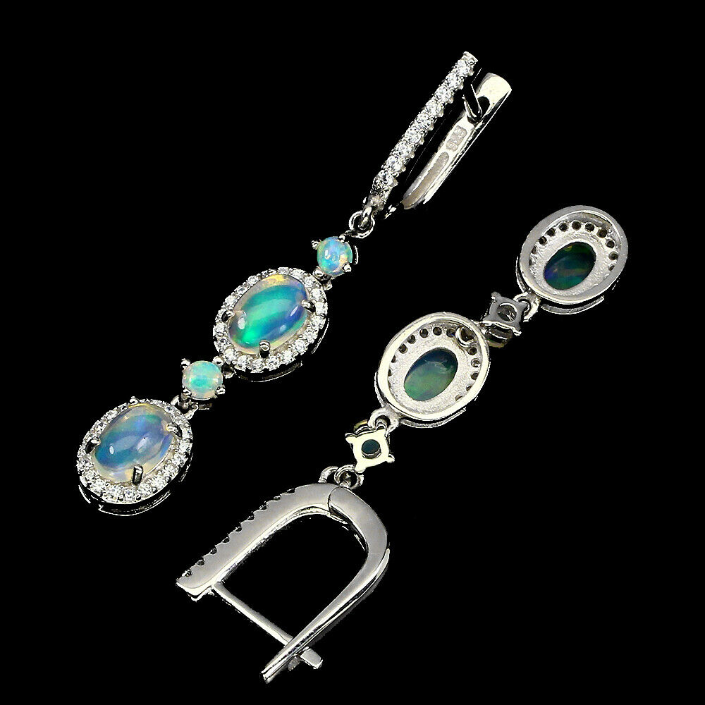 A pair of 925 silver drop earrings set with cabochon cut opals and white stones, L. 4.5cm. - Bild 2 aus 2