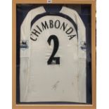A framed autographed Spurs football shirt, frame size 66 x 87cm.