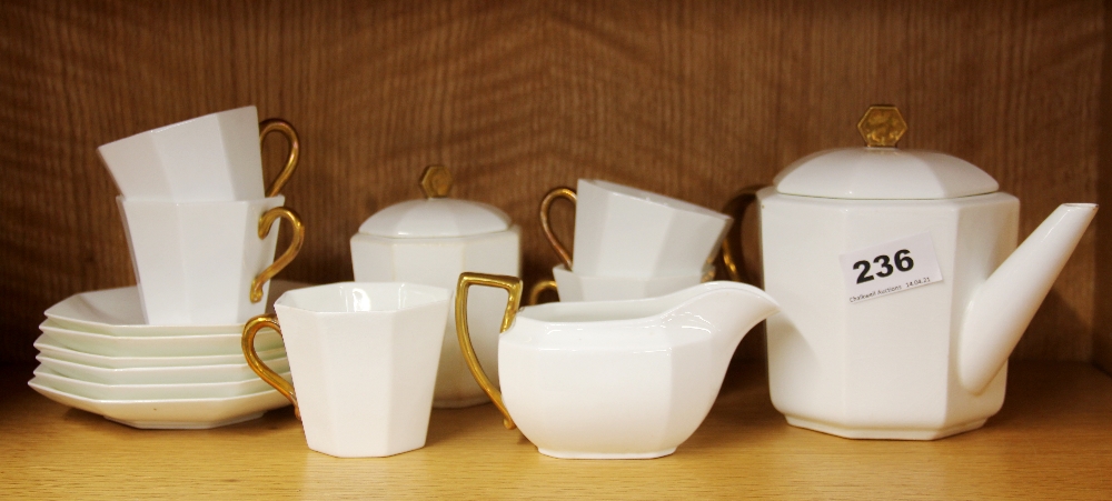 A 1920's Wedgwood gilt porcelain tea set, teapot A/F.