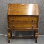 A small oak bureau, W. 70cm. D. 33cm.