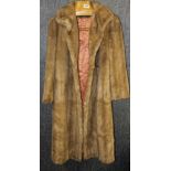 A vintage faux fur and leather coat.