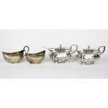 A pair of hallmarked silver glass lined salts and spoons together with a further pair of
