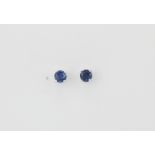 A pair of 9ct white gold sapphire set stud earrings, Dia. 0.3cm.