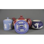 An unusual red Wedgwood teapot together with a Wedgwood box and cover and an Adams bowl with an