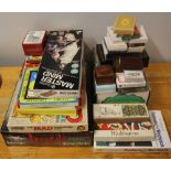 A quantity of mixed playing cards and games.