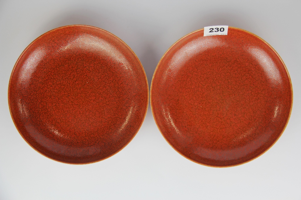 A pair of Chinese glazed orange/ red porcelain bowls, Dia. 22.5cm.