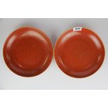 A pair of Chinese glazed orange/ red porcelain bowls, Dia. 22.5cm.