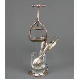 A silver plated ice crusher, H. 31cm, with advertising glass of Bells and an assortment of silver