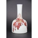 A Chinese splash glazed porcelain bottle vase, H. 19cm. six character mark to base.