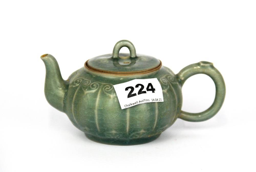 A Chinese celadon glazed teapot, L. 15cm.