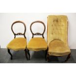 An early 19th Century walnut nursing chair and a pair of 19th Century balloon back chairs.