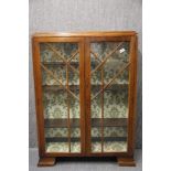 An Art Deco glazed oak bookcase, 88 x 122cm.