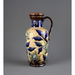 A Louisa E Edwards Doulton Lambeth stoneware jug, H. 22cm. Condition : repair to handle.