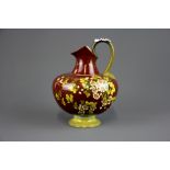 A Doulton Lambeth faience flagon painted with flowers, H. 20cm. Condition : very minor chip to the