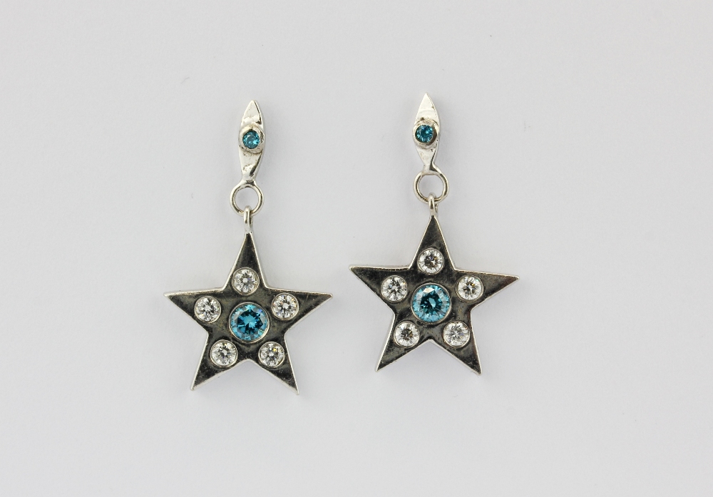 A pair of 18ct white gold (stamped 750) star shaped drop earrings set with brilliant cut fancy