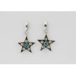 A pair of 18ct white gold (stamped 750) star shaped drop earrings set with brilliant cut fancy