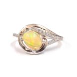 A 925 silver ring set with a cabochon cut opal and white stones, (P).