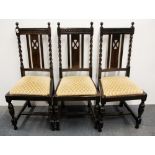 Three oak barley twist dining chairs.