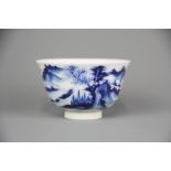A fine Chinese hand painted porcelain tea bowl with underglaze blue and red decoration of a mountain