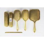 A hallmarked 9ct gold six piece dressing table set.