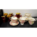 A Crown Devon red and gilt coffee set with a small group of Royal Albert china.