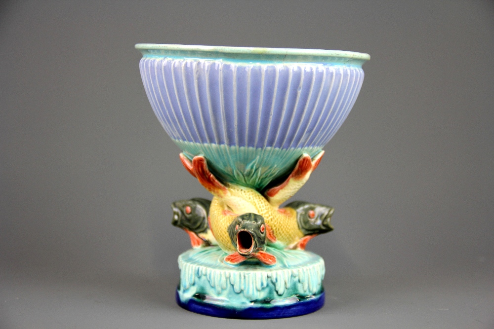 A Royal Worcester Majolica bowl mounted on a centre column of three open mouthed fish, H. 13cm.