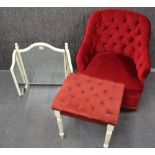A button backed red upholstered boudoir chair together with a similar footstool and a free