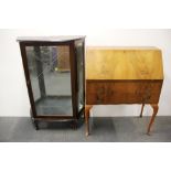 A 1950's glazed display cabinet and a satinwood veneered bureau.