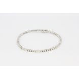 An 18ct white gold (stamped 750) tennis bracelet set with brilliant cut diamonds, approx. 5.11ct