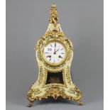 A wooden gilt metal and faux mother of pearl mantel clock by Berger of Paris, H. 41cm.
