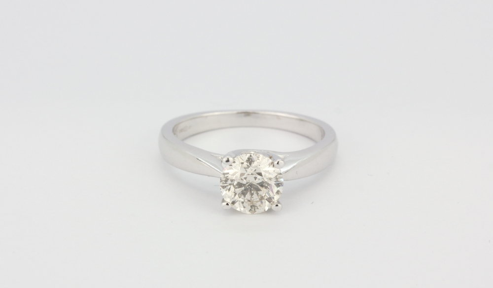 An 18ct white gold (stamped 18k) solitaire ring set with a brilliant cut diamond, approx 1.32ct, (