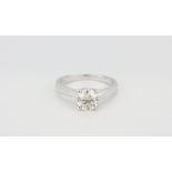 An 18ct white gold (stamped 18k) solitaire ring set with a brilliant cut diamond, approx 1.32ct, (