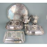 A silver plated tray on four feet together with three silver plated tureens, also including coffee
