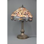 A Tiffany style table lamp decorated with fireflies. 47cm