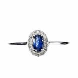 A matching 925 silver ring set with an oval cut sapphire and white stones, (P.5).